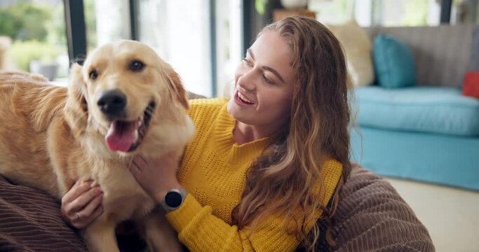 Happy woman, dog and play in home for care, love or friends bonding together in living room. Animal, girl or pet owner with golden retriever on sofa to relax, smile or connection for support in house