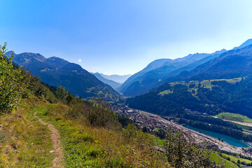 Scenic aerial view of mountain village Airolo with Leventina Valley in the Swiss Alps on a sunny late summer day. Photo taken September 10th, 2023, Gotthard, Canton Ticino, Switzerland.