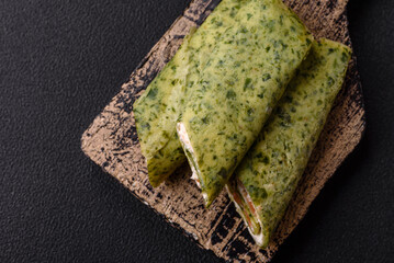 Delicious homemade pancakes with spinach, salmon, Philadelphia cheese