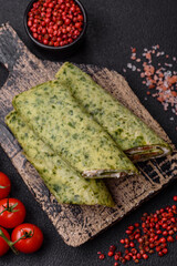 Delicious homemade pancakes with spinach, salmon, Philadelphia cheese