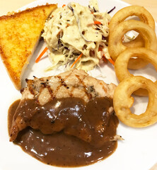 Grilled Chicken and Black Pepper Sauce with Toasted, Salad and Onion Ring