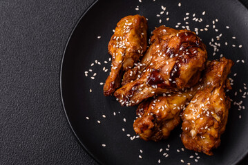 Delicious crispy grilled wings with teriyaki sauce with salt, spices