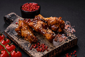 Delicious crispy grilled wings with teriyaki sauce with salt, spices