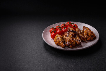 Delicious crispy grilled wings with teriyaki sauce with salt, spices