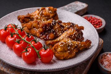 Delicious crispy grilled wings with teriyaki sauce with salt, spices