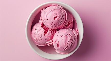 Bowl with pink ice cream scoops on pastel purple background, top view.