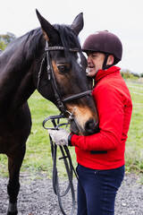 Obraz premium Retired Man Petting Horse's Head in Countryside