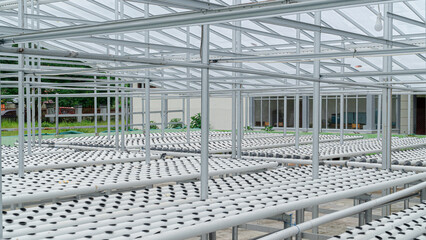 a room filled with hollow pipes for planting vegetable seeds