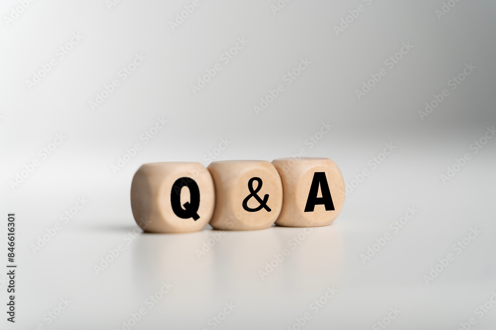 Fototapete Q and A - an abbreviation of wooden blocks with letters on a white background. Question and Answer.
