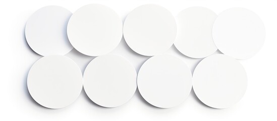 Collection of round white sticker labels isolated on a white background with a clipping path for a copy space image.