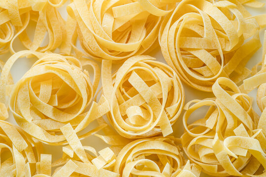 Italian pasta tagliatelle  close-up. Food background.