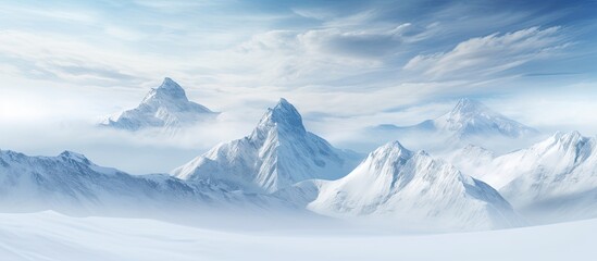 Snow-covered mountains with a white background provide a copy space image.