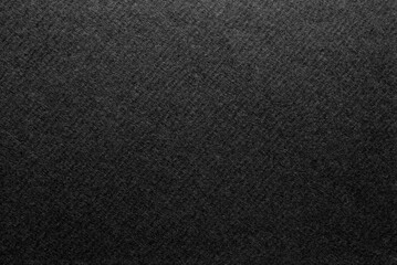 Fototapeta premium Black paper texture, a sheet of corrugated black color cardboard texture as background