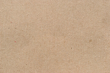 A sheet of brown recycled cardboard texture as background