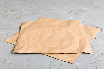 top view with baking parchment empty on table background. Folded cloth for mockup with copy space,...
