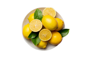Fresh cutted lemon and whole lemons over round plate isolated on white background. Food and drink ingredients preparing. healthy eating theme top view with copy space