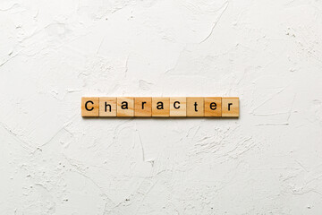 CHARACTER word written on wood block. CHARACTER text on cement table for your desing, concept