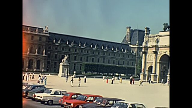 PARIS, FRANCE - CIRCA 1968: Arch of triumph of the Carrousel, Arc de Triomphe du Carrousel panorama from Jardin des Tuileries garden, at Louvre Museum. Historic restored footage in 1960s.