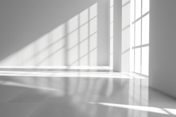 A room with a window and a white wall