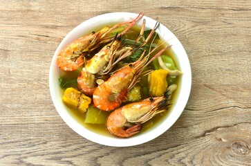 boiled spicy mixed vegetable topping grilled river shrimp soup on plate