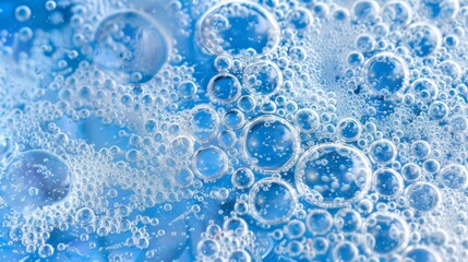 Close-up of translucent soap bubbles in soft blue tones