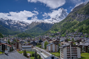 we stay at Zermatt village and see matterhorn in sunny cloudy sky day .it is very beautiful .
