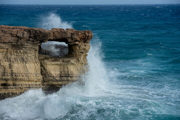 waves crashing on rocky coast. Windy weather , Powerful sea waves braking on rocks