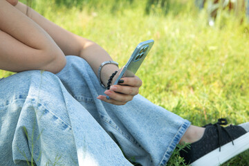 Caucasian woman using mobile phone in outdoors.