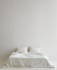 Bright room with a bed made up of white linens