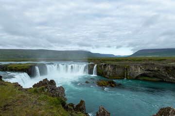 Iceland Akureyri landcape with waterfall on the river on a sunny day