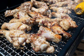 Chicken legs on the barbecue grill