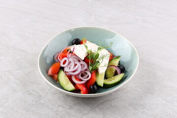 Salad with cheese and fresh vegetables isolated on white background. Greek salad.