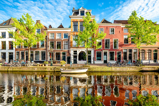 Traditional Dutch brick buildings on the riverside in Leiden, Netherlands