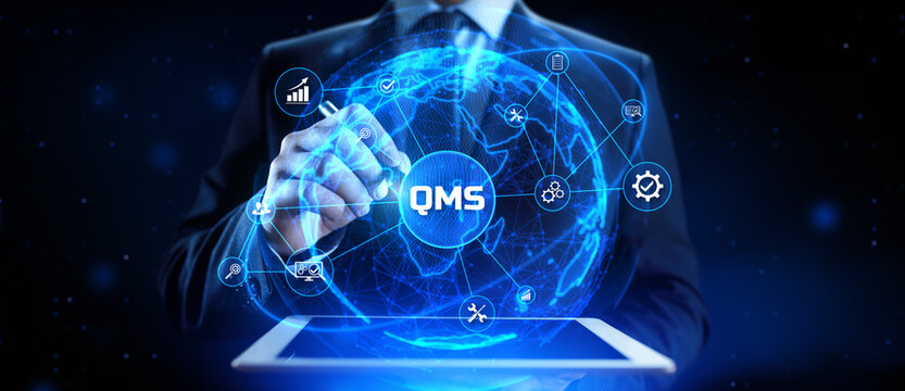 QMS Quality management system. Businessman pressing virtual button.
