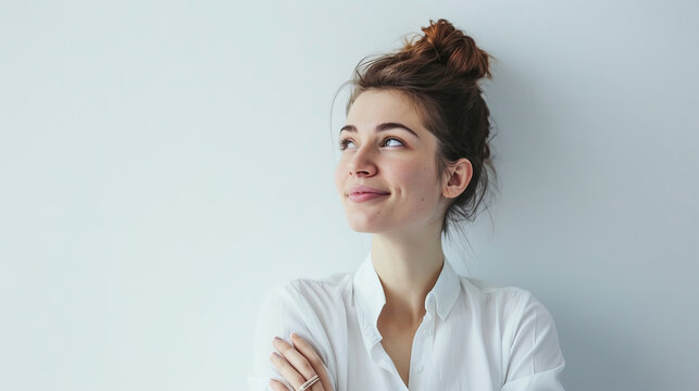 Happy businesswoman daydreaming while looking to the side