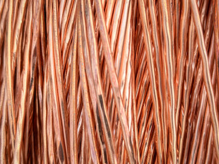 Aligned copper wires displaying consistent patterns and detailed textures in a parallel arrangement.