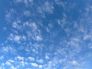 Clear Blue Sky with Soft White Clouds