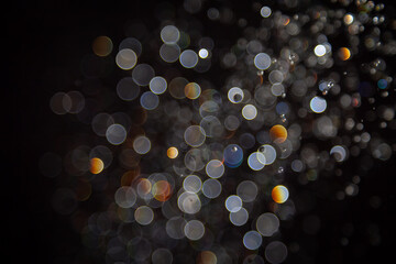 Luxury Bokeh with gold light and colurful rainbow curcle on black
