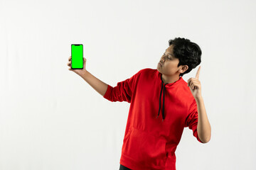 young asian man using his green screen cellphone to show something. independence day concept. isolated white background