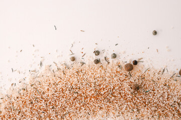 Italian salt with spices on a white background