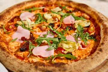 Delicious Summer Pizza with Mortadella, Artichokes, and Arugula in Sunlight and Shadow
