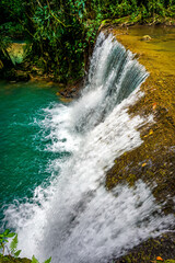 in Jamaica a set of 7 different height and difficulty waterfalls with plentiful of ziplining, swimming and enjoyment.