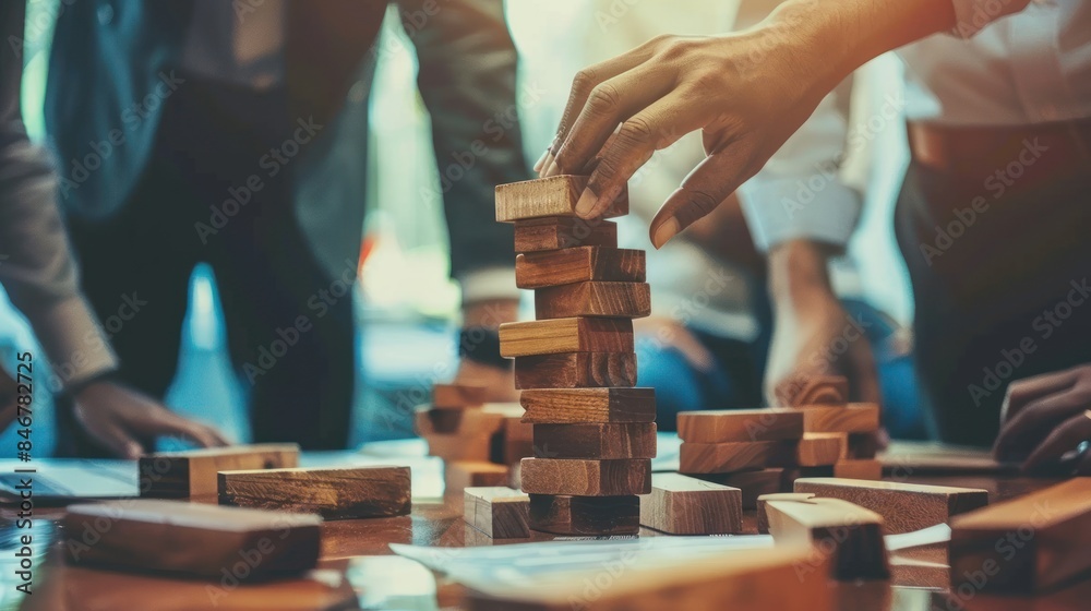 Wall mural businessman and businesswoman group plan and play jenga wooden box