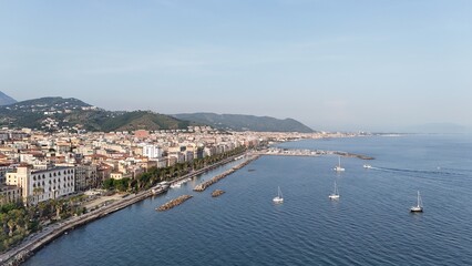 Salerno, in Campania, is famous for the stunning Amalfi Coast. It offers breathtaking views of the Tyrrhenian Sea, beautiful beaches, and a lively promenade, perfect for scenic walks