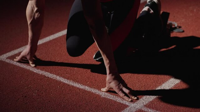 Strong Athletic Man On Start On Sprinter Lane, Closeup Of Muscular Male Arms, Professional Runner