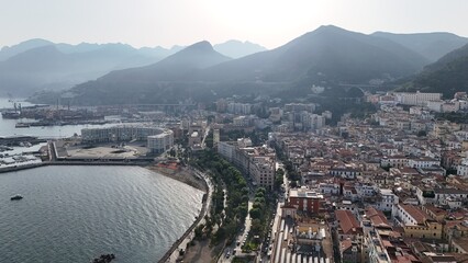 Salerno, in Campania, is famous for the stunning Amalfi Coast. It offers breathtaking views of the Tyrrhenian Sea, beautiful beaches, and a lively promenade, perfect for scenic walks