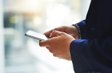 Man, hands and phone typing in office for communication, networking and information of profit report. Male person, mobile and scroll for email, research and investment of digital finance notification