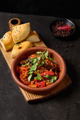 Traditional Adjapsandal with Stewed Vegetables - Eggplants, Bell Peppers, and Tomatoes Garnished with Cilantro and Authentic Spices