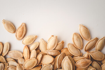 Pumpkin seeds on white background