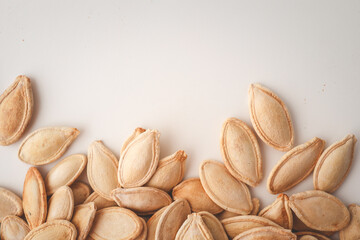 Pumpkin seeds on white background